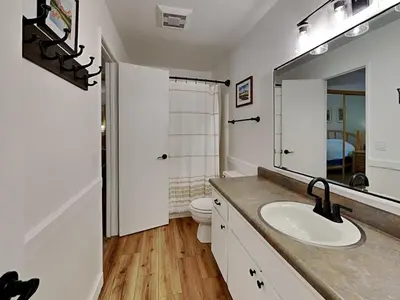 a bathroom with a sink and a toilet and a mirror at 1849 Condos 542 condo in Mammoth Lakes