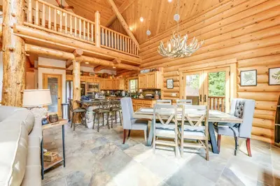 a dining room with a table and chairs at Mountain Cabin with Hot Tub 4 Mi to Shaver Lake! in Shaver Lake