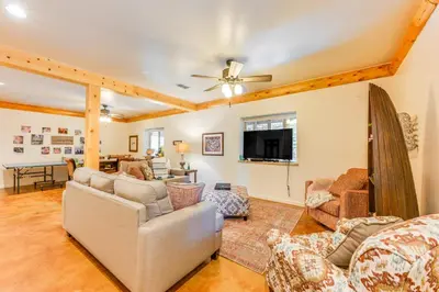 a living room with couches and a tv at Mountain Cabin with Hot Tub 4 Mi to Shaver Lake! in Shaver Lake