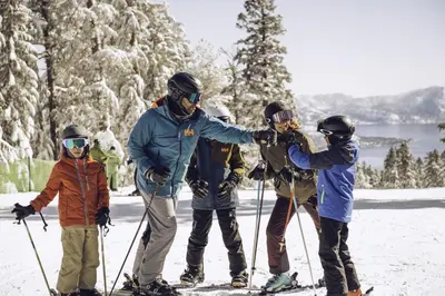 a group of people on skis in the snow at Lofted Retreat in The Village! condo in Truckee
