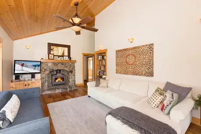 a living room with a couch and a fireplace at Mineral Springs 3 BR w Hot tub Available in Alpine Meadows in Olympic Valley