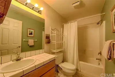 a bathroom with a sink and a toilet and a shower at Suite Sunshine A in Yosemite West