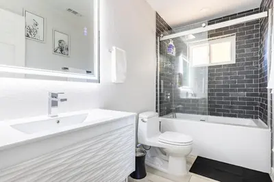 a bathroom with a sink and a toilet and a bath tub at Rolling Oaks Ranch - 200 Acres of Lakeside Beauty & Countryside Serenity in Mariposa