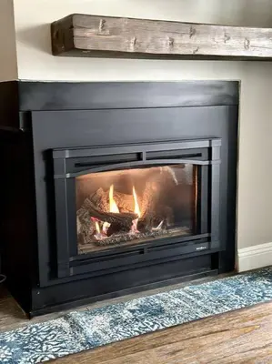a fireplace with a fire in it in a room at Rustic Modern Condo - Close to Village - Sleeps 10 in Mammoth Lakes