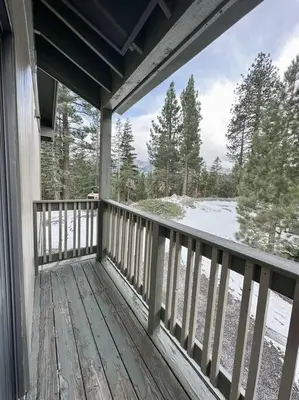 a porch of a house with snow on the ground at Rustic Modern Condo - Close to Village - Sleeps 10 in Mammoth Lakes