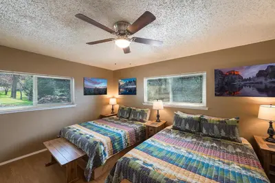 a bedroom with two beds and a ceiling fan at Mountain View, near Yosemite & Bass Lake, BBQ, Fireplace,EVC in Oakhurst
