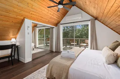 a bedroom with a bed with a ceiling fan at Cozy Yosemite Family Retreat-13mi to South Gate in Oakhurst