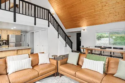 a living room with a couch and a table at Cozy Yosemite Family Retreat-13mi to South Gate in Oakhurst