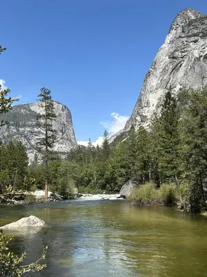 a river with a mountain in the background at Cozy Yosemite Family Retreat-13mi to South Gate in Oakhurst