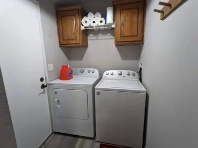 a small kitchen with a stove and a washer at Home in Groveland near Yosemite NP in Groveland