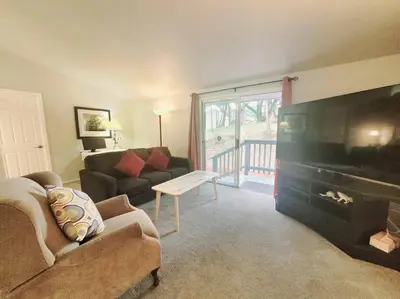 a living room with a couch and a large flat screen tv at Home in Groveland near Yosemite NP in Groveland