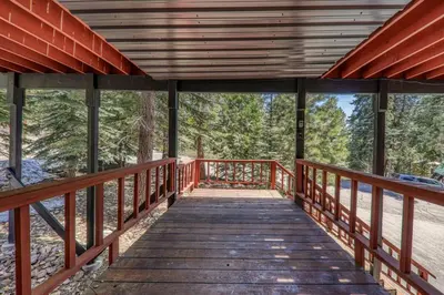 a wooden bridge with a view of the woods at Carnelian Bay 4BD Near Beach & Slopes in Carnelian Bay