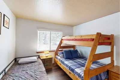 a bedroom with two bunk beds and a bed at Scenes of Evergreens in Incline Village