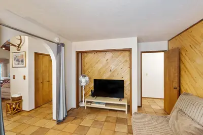 a living room with a flat screen tv on a wall at Scenes of Evergreens in Incline Village