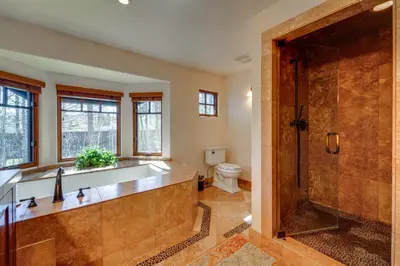 a bathroom with a tub and a toilet at Private Patio and Gas Grill Stunning Truckee Home in Truckee