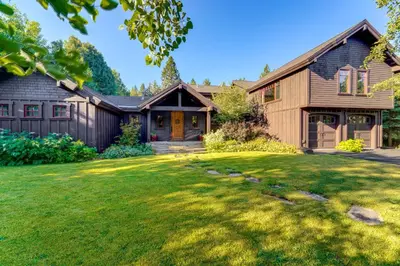 a house with a green lawn in front of it at Private Patio and Gas Grill Stunning Truckee Home in Truckee