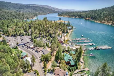 an aerial view of a resort on a lake at #4 Cottage Like Suite with Private Hot Tub in Bass Lake