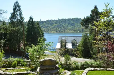 a house with a view of a lake at Fox Lake View in Bass Lake