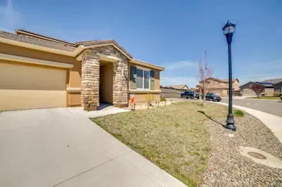 a house with a street light next to a driveway at WWII Aviation-Themed Apt in Sparks Near Parks! in Sparks