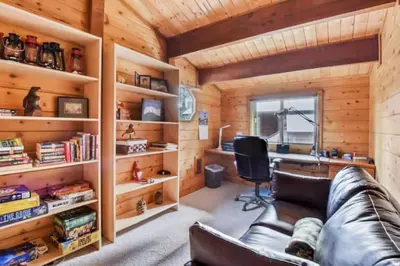 a living room with a leather couch and a desk at Incline Village Getaway in Incline Village