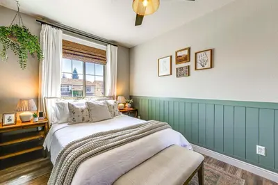 a bedroom with a large bed and a window at Enchanting Clovis Haven with Hot Tub and Private Pool! in Clovis