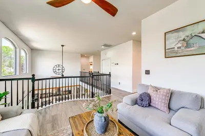 a living room with a couch and a table at Enchanting Clovis Haven with Hot Tub and Private Pool! in Clovis