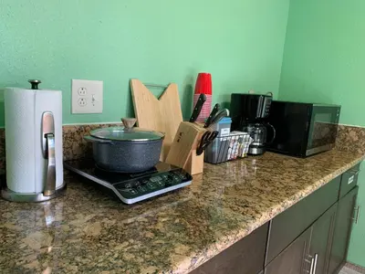a kitchen counter with a pot on a stove at Cozy Suite with Private Patio Close to Downtown and UC Davis Medical Center in Sacramento
