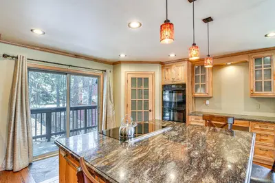 a kitchen with a counter top and a large window at 1 Mi to Ski Resort South Lake Tahoe Townhome in South Lake Tahoe