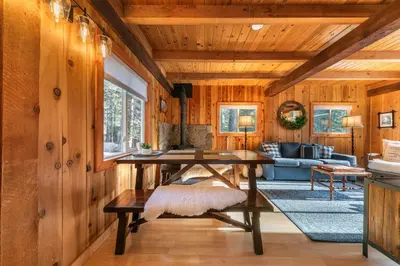 a living room with a table and a couch at 3BD Retreat - 5 Min to Beach Trails & Town in Carnelian Bay