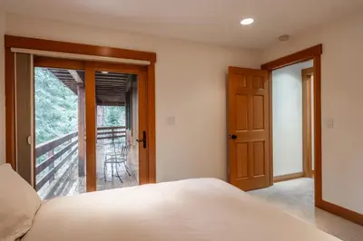 a bedroom with a bed and a balcony at Northstar - Northstar Vista in Truckee