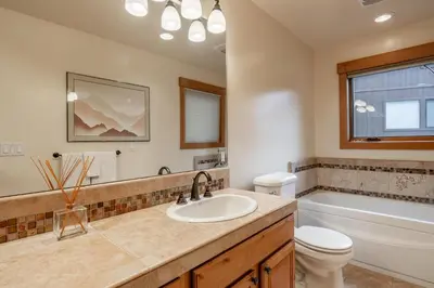 a bathroom with a sink and a toilet and a tub at Northstar - Northstar Vista in Truckee