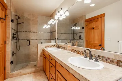 a bathroom with two sinks and a shower at Northstar - Northstar Vista in Truckee
