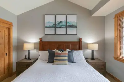 a bedroom with a white bed with two lamps at The Cottages - Ski Shuttle, Ski Valet - 2-Bedroom in Truckee