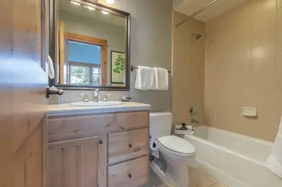 a bathroom with a sink and a toilet and a tub at The Cottages - Ski Shuttle, Ski Valet - 2-Bedroom in Truckee