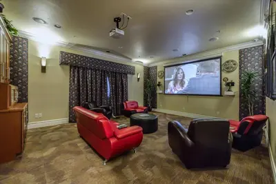a large living room with a flat screen tv at Relaxing 2-BR Apt with Pool Hot Tub Gym and Basketball Court Access in Reno
