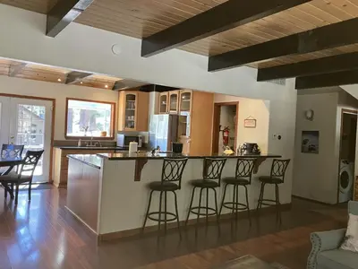 a kitchen with a counter and bar stools at Mountain Escape in South Lake Tahoe
