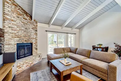 a living room with a couch and a fireplace at Sierra Tranquility in Incline Village