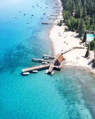 an aerial view of a beach with boats in the water at Newly Renovated Family Lake House, Private Beach! in Tahoma