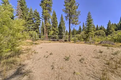 a dirt field with a goal in the middle of a forest at Steps to Lake Scenic Carnelian Bay Retreat in Carnelian Bay
