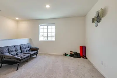 a living room with a couch and a window at Spacious Family Home in Stockton - Pets Welcome! in Stockton
