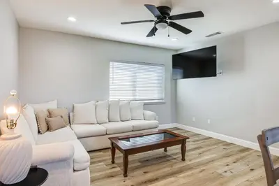 a living room with a couch and a ceiling fan at Pet-Friendly Hughson Getaway, 9 Mi to Modesto! in Hughson