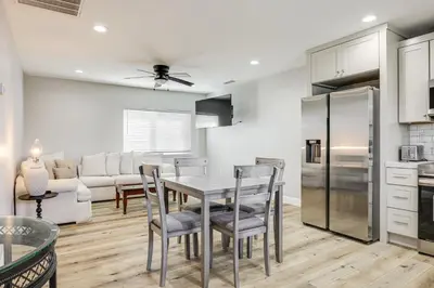 a kitchen and dining room with a table and chairs at Pet-Friendly Hughson Getaway, 9 Mi to Modesto! in Hughson