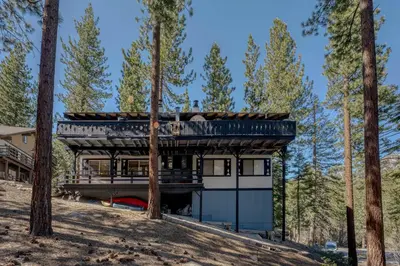 a house in the woods with a metal roof at 3BR with Hot Tub 1 Mile to Diamond Peak in Incline Village