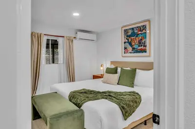 a white bedroom with a bed and a window at Luxurious 7BR Walk 2 Beach and Bus Stop in Carnelian Bay