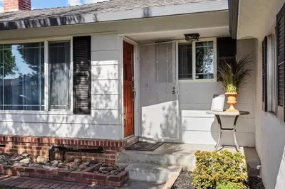a front door of a house with a plant on it at Trinity Escape Entire home near Lodi Lake in Lodi