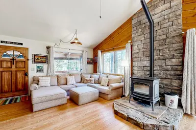 a living room with a couch and a fireplace at The Venado House in Arnold