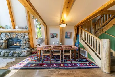 a dining room with a table and a fireplace at 4BD with Lake Views Near Beach and Slopes in Tahoe City
