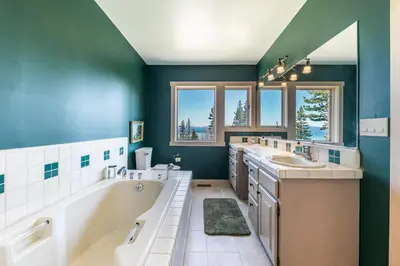 a bathroom with two sinks and a tub and two sinks at 4BD with Lake Views Near Beach and Slopes in Tahoe City