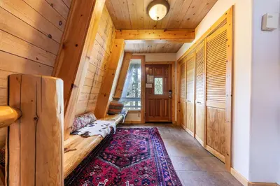 a living room with a couch and a rug at 4BD with Lake Views Near Beach and Slopes in Tahoe City