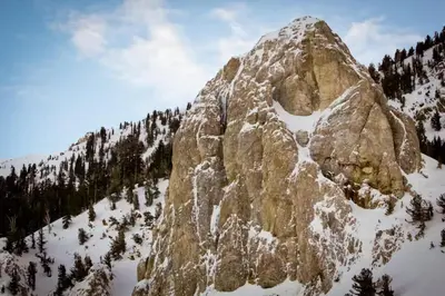 a large rocky mountain with snow on it at Bigwood 54 K in Mammoth Lakes